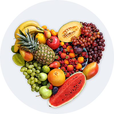 a variety of fruits arranged in the shape of a heart